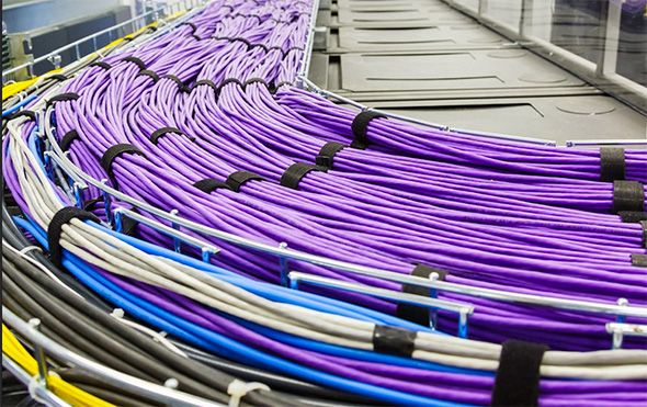 Setting up advanced network cabling for a new high-capacity data center.